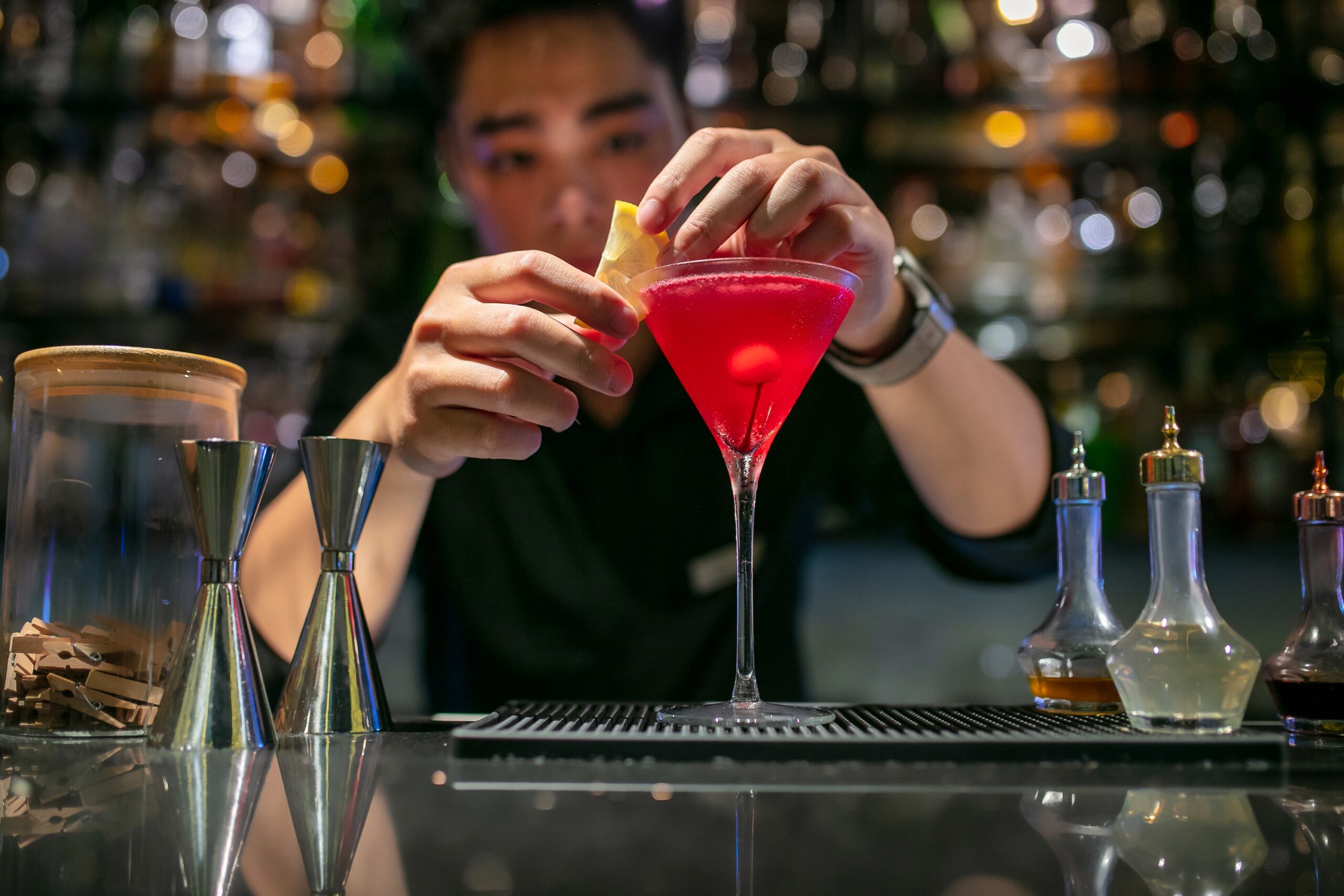Signature cocktail served at Diamond Sky Bar Hanoi with city skyline background